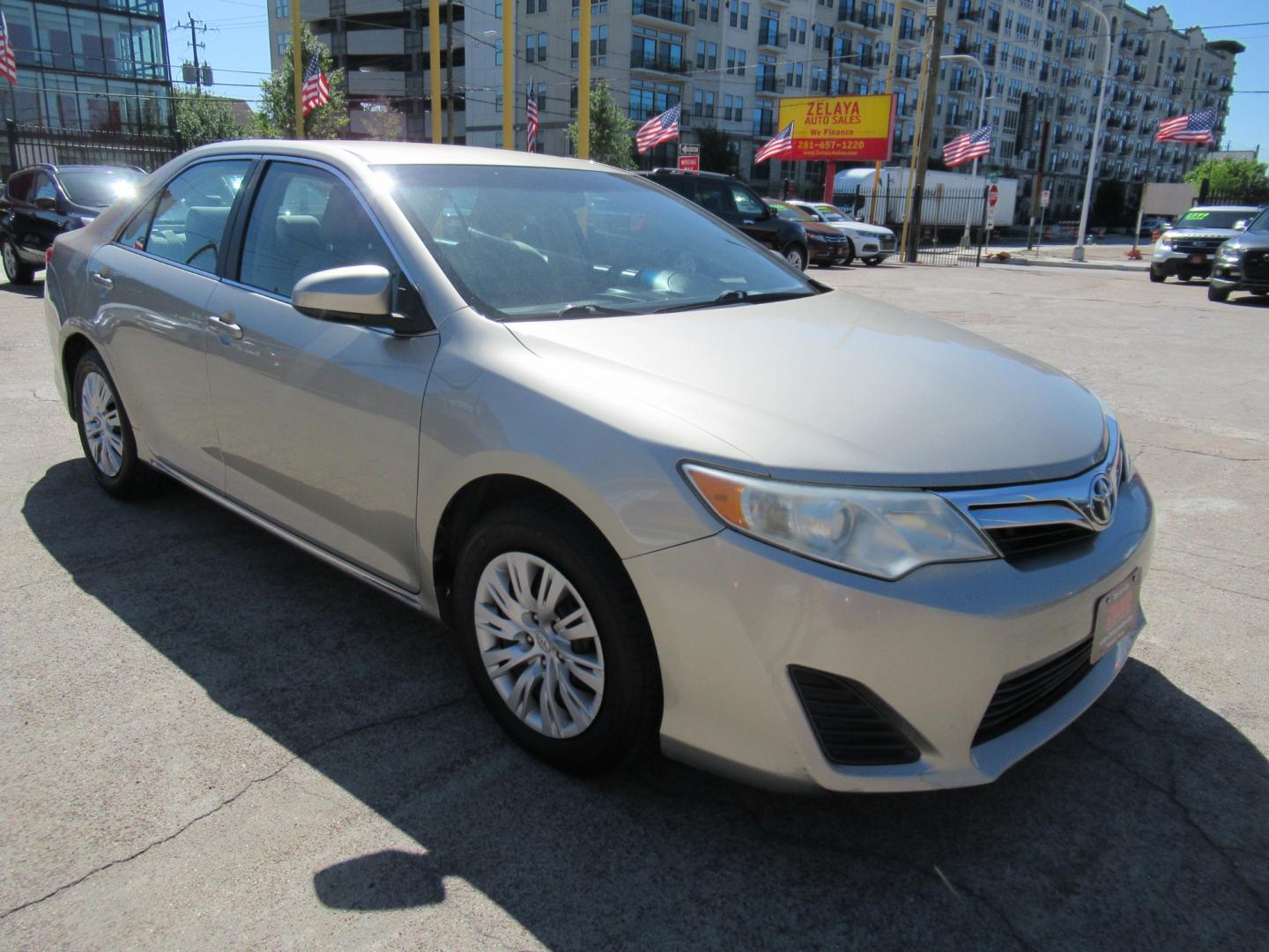 2014 /Tan Toyota Camry L (4T4BF1FK2ER) with an 2.5L L4 DOHC 16V engine, Automatic transmission, located at 1511 North Shepherd Dr., Houston, TX, 77008, (281) 657-1221, 29.798361, -95.412560 - 2014 TOYOTA CAMRY LE VIN: 4T4BF1FK2ER364962 4 T 4 B F 1 F K 2 E R 3 6 4 9 6 2 SEDAN 4 DR 2.5L I4 F DOHC 16V GASOLINE FRONT WHEEL DRIVE - Photo#19